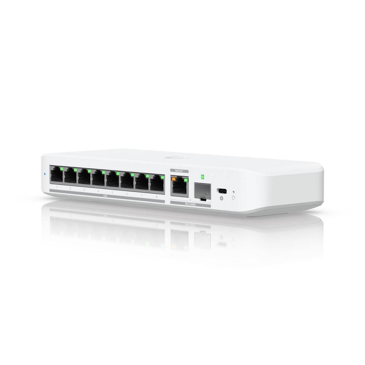 Ein weißer Netzwerk-Switch mit acht Ethernet-Ports, einer Netzbetriebsanzeige und einem Netzteileingang auf der rechten Seite, vor einem einfarbigen Hintergrund.