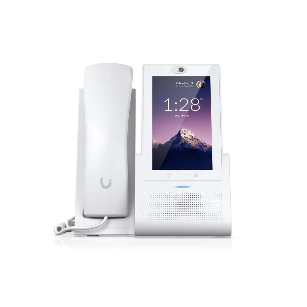 Ein weißes intelligentes Schreibtischtelefon mit einem Touchscreen, der die Zeit '1:28' und ein Hintergrundbild eines Berges anzeigt.