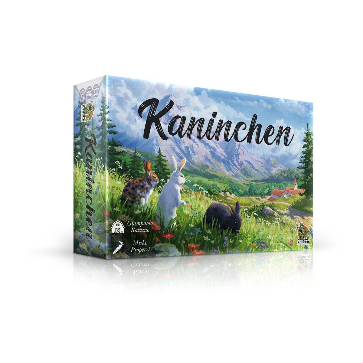 Schachtel eines Brettspiels mit dem Titel 'Kaninchen', die eine Illustration von Kaninchen auf einer Wiese mit Bergen und Bäumen im Hintergrund zeigt.