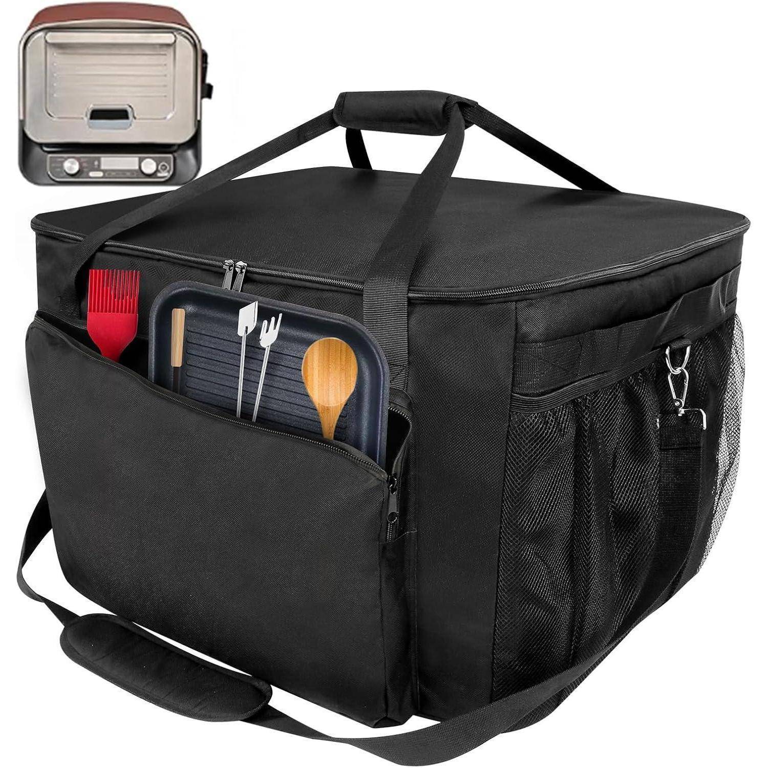 Eine große schwarze isolierte Tasche mit Reißverschluss und Außentaschen, die Grillutensilien enthält, darunter einen Pfannenwender und eine Backpinsel.