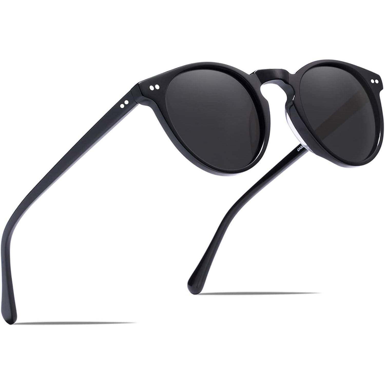 Schwarze Sonnenbrille mit runden Gläsern und schlanken, geschwungenen Bügeln vor einem weißen Hintergrund.