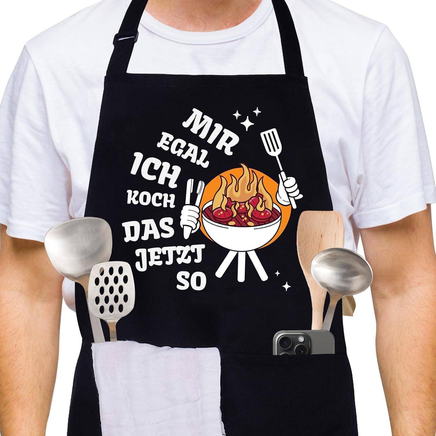 Person mit einer schwarzen Schürze mit dem Text 