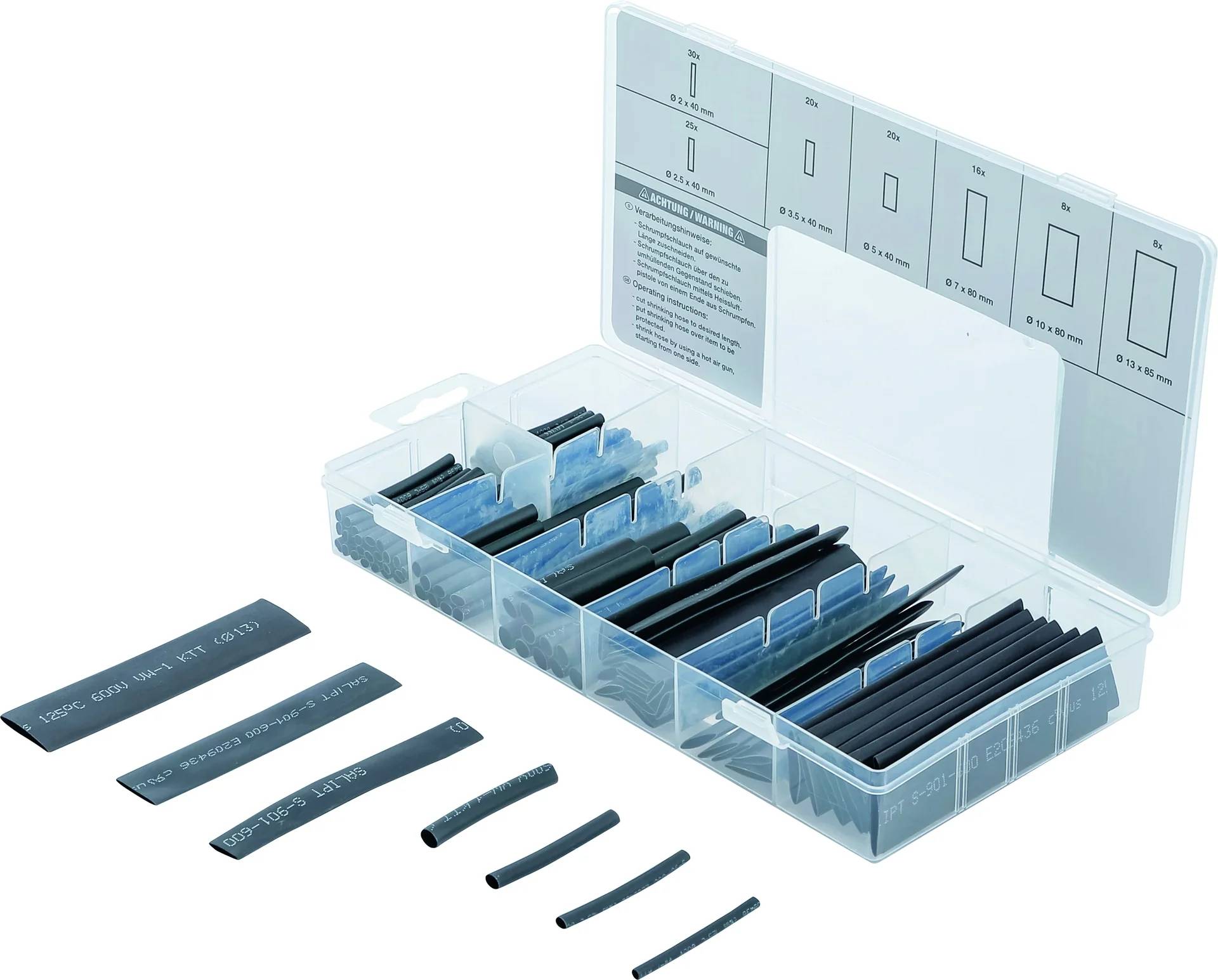 Eine transparente Box mit Schrumpfschlauch in verschiedenen Größen, schwarz. Einige Stücke liegen davor ausgebreitet. Ein Leitfaden ist auf der Innenseite des Deckels sichtbar.