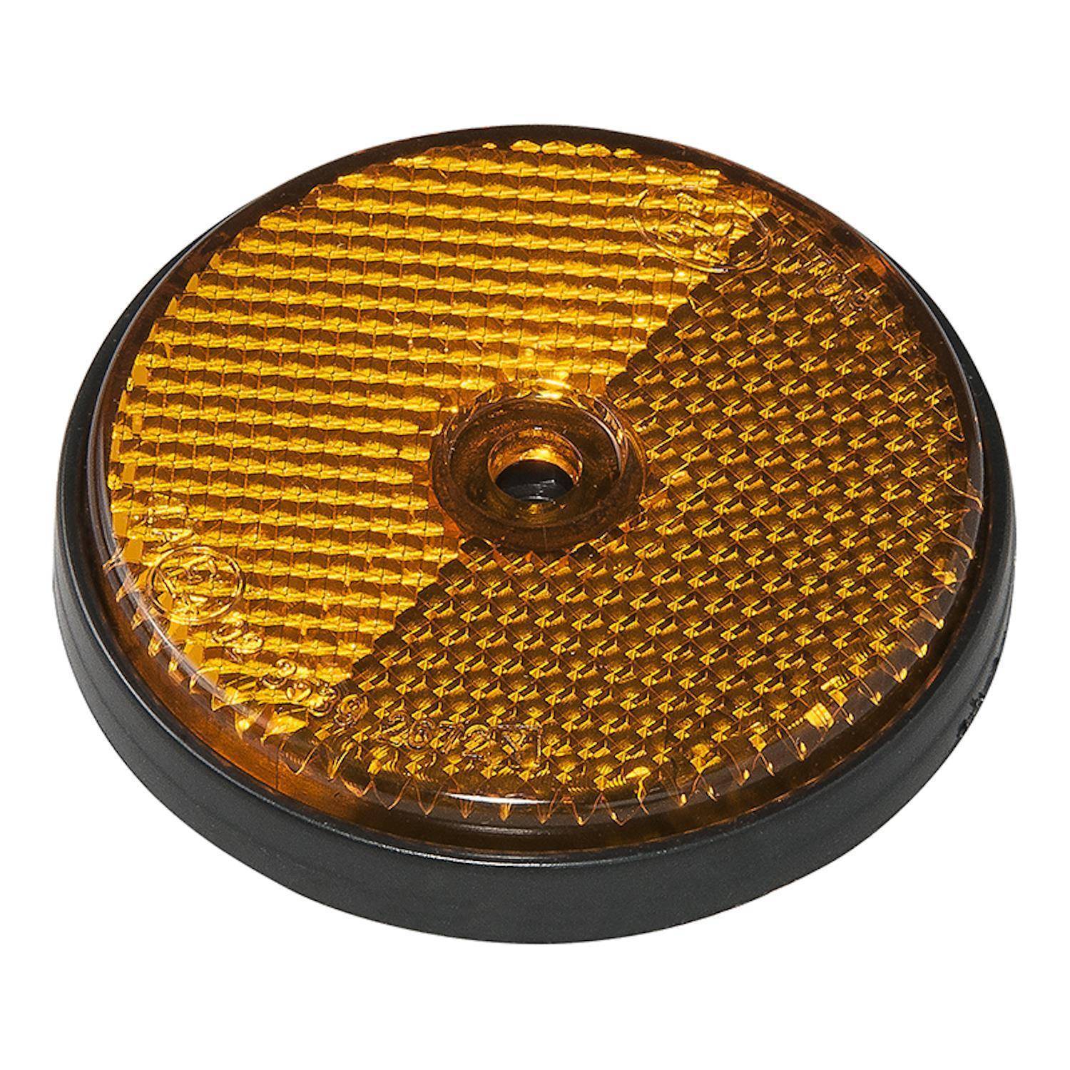 „Runder Bernsteinrückstrahler mit strukturierter Oberfläche, zentriert auf einem weißen Hintergrund, mit einem zentralen Schraubenloch zur Befestigung.