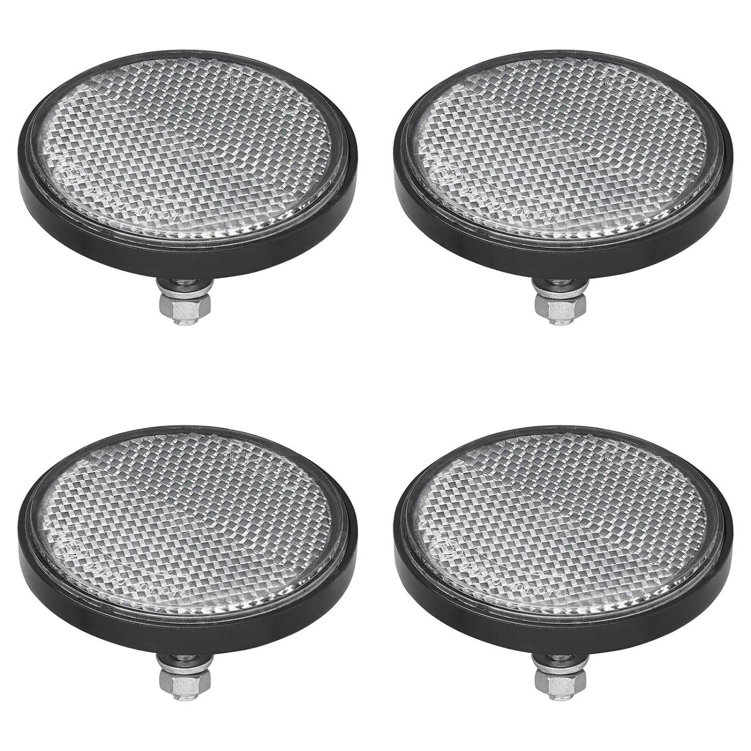 Vier runde Fahrradrückstrahler mit strukturierten Oberflächen, in einem Gittermuster gegen einen weißen Hintergrund angeordnet.