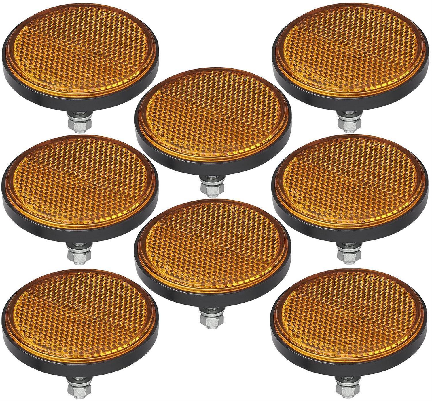 Bild von acht runden orangefarbenen Reflektoren mit schwarzen Rändern, die in zwei parallelen Reihen auf einem weißen Hintergrund angeordnet sind.