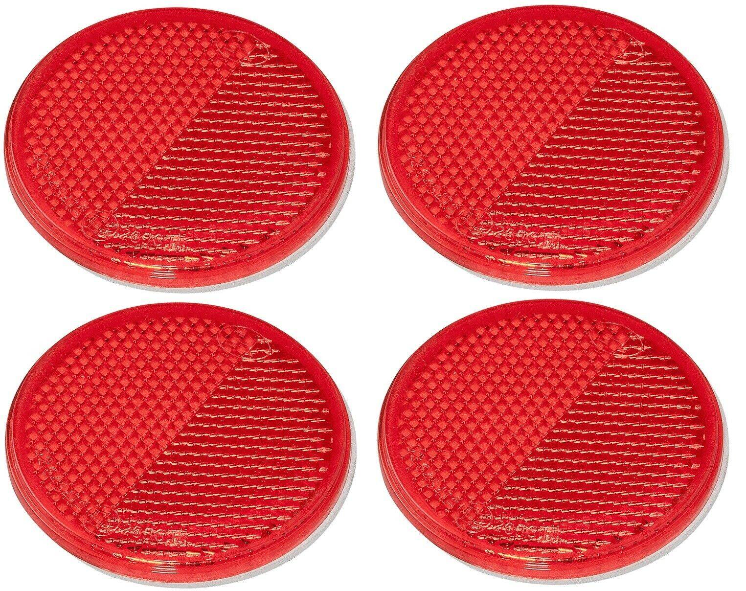 Vier runde rote reflektierende Marker, jeder mit einer strukturierten Oberfläche, in einem 2x2-Raster auf einem schlichten weißen Hintergrund angeordnet.