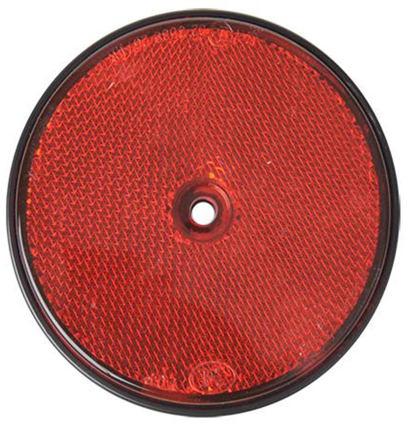 Ein rundes, rotes Rückstrahlelement mit einem zentralen Befestigungsloch; typischerweise verwendet für Fahrräder, Fahrzeuge oder Sicherheitsausrüstung zur Sichtbarkeit.