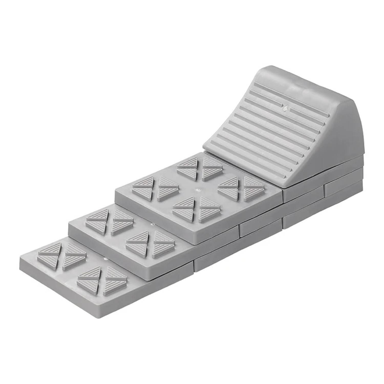 Eine graue Gummi-Autorampe mit strukturierter Oberfläche und gerillten Stufen, die entwickelt wurde, um Radrutschungen zu verhindern und Stabilität während Wartungsarbeiten zu gewährleisten.