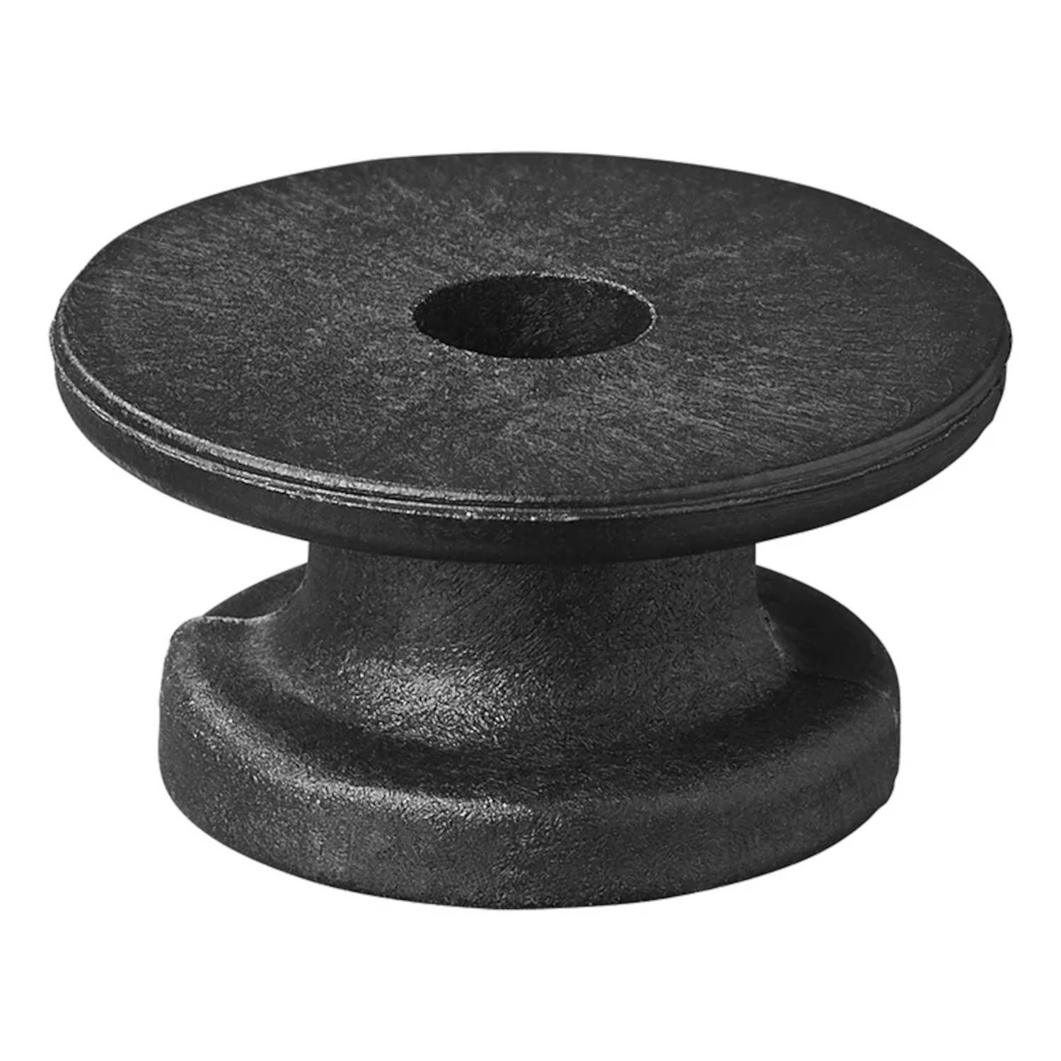 Ein massiver schwarzer Metallpoller, zylindrisch mit flacher Oberseite und einem zentralen Loch, der zum Festmachen von Seilen auf dem Deck eines Schiffes verwendet wird.