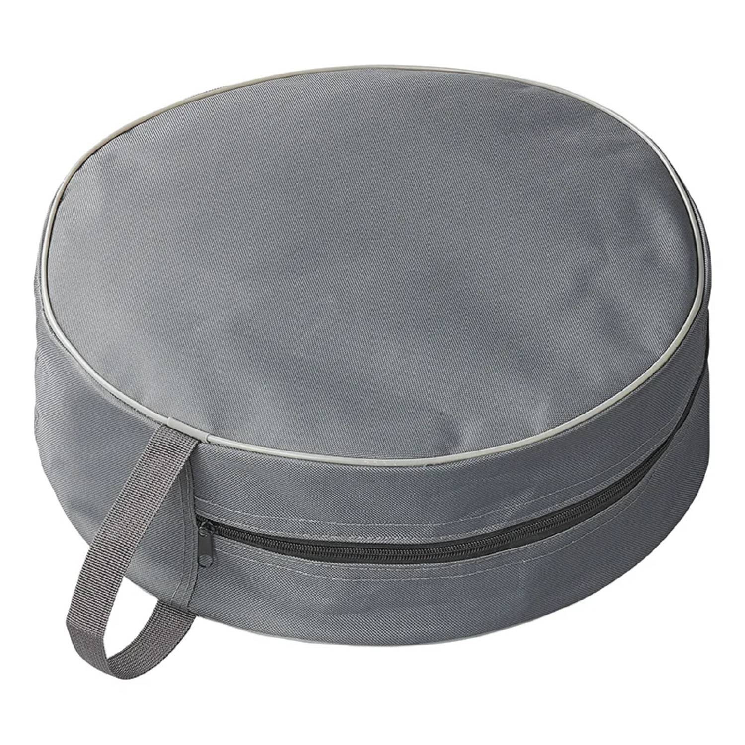 Ein runder grauer Kissen mit Stoffgriff und Reißverschlussseite, konzipiert für Aufbewahrung und Transportierbarkeit.
