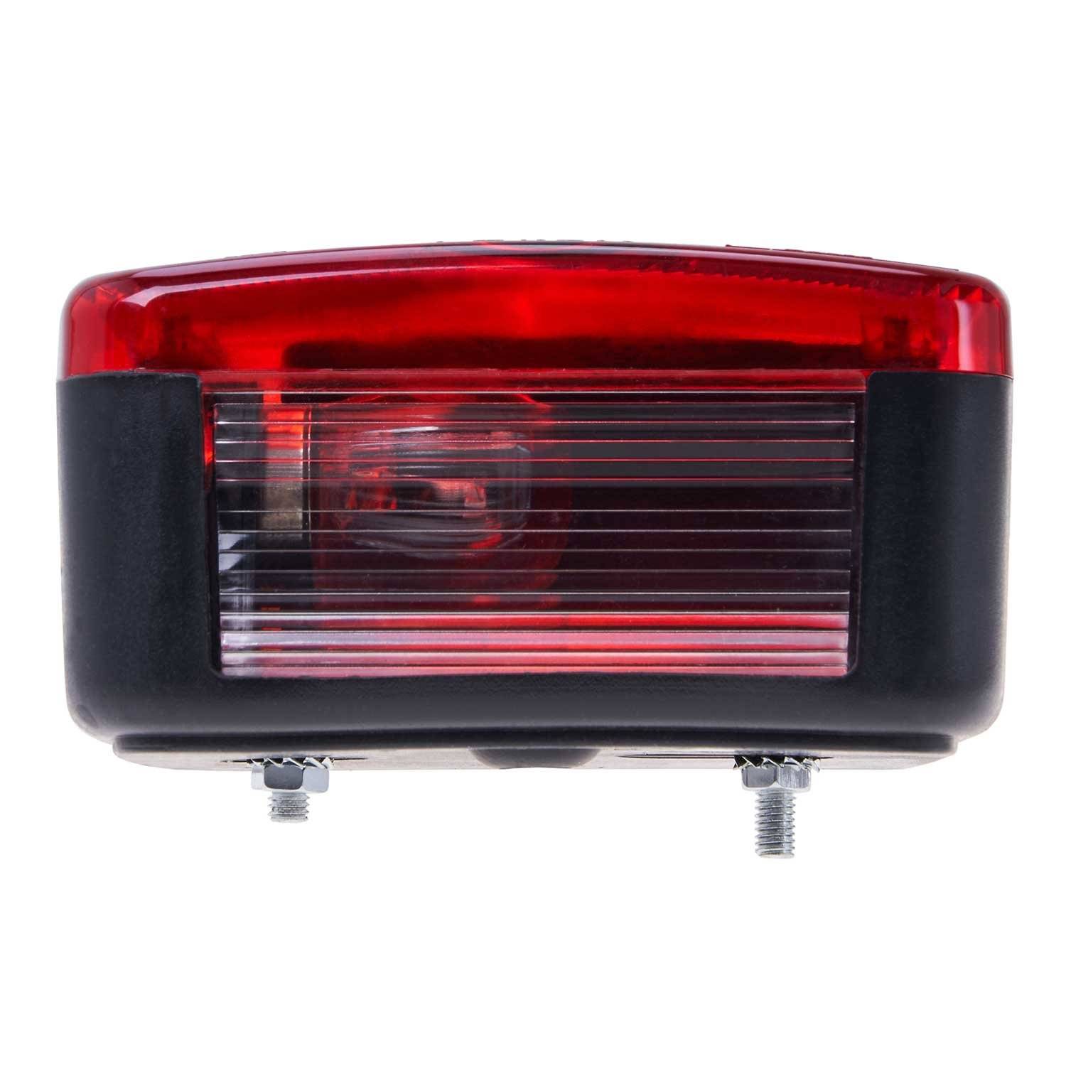 Ein rotes Automotive-Rücklicht mit klarer Linse, montiert auf einer schwarzen Basis, von vorne betrachtet, wobei die Glühbirne und interne Details sichtbar sind.