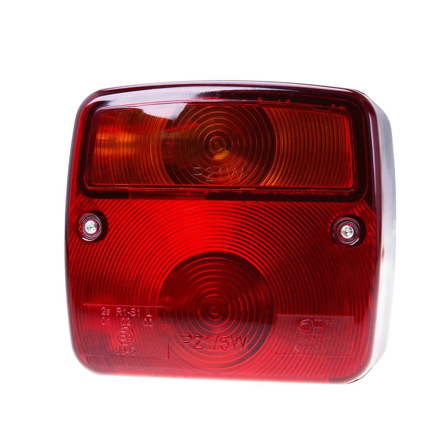 Ein rotes rechteckiges Rücklicht für ein Fahrzeug, das zwei kreisförmige Linsenmuster aufweist und mit zwei Schrauben befestigt ist.