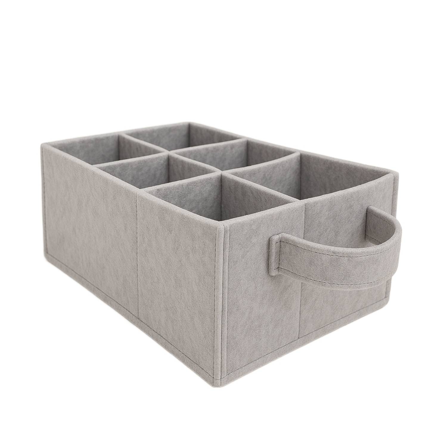 Eine Aufbewahrungsbox aus Stoff mit sechs Fächern und einem Griff, entwickelt zur Organisation von kleinen Gegenständen. Die Box ist hellgrau.