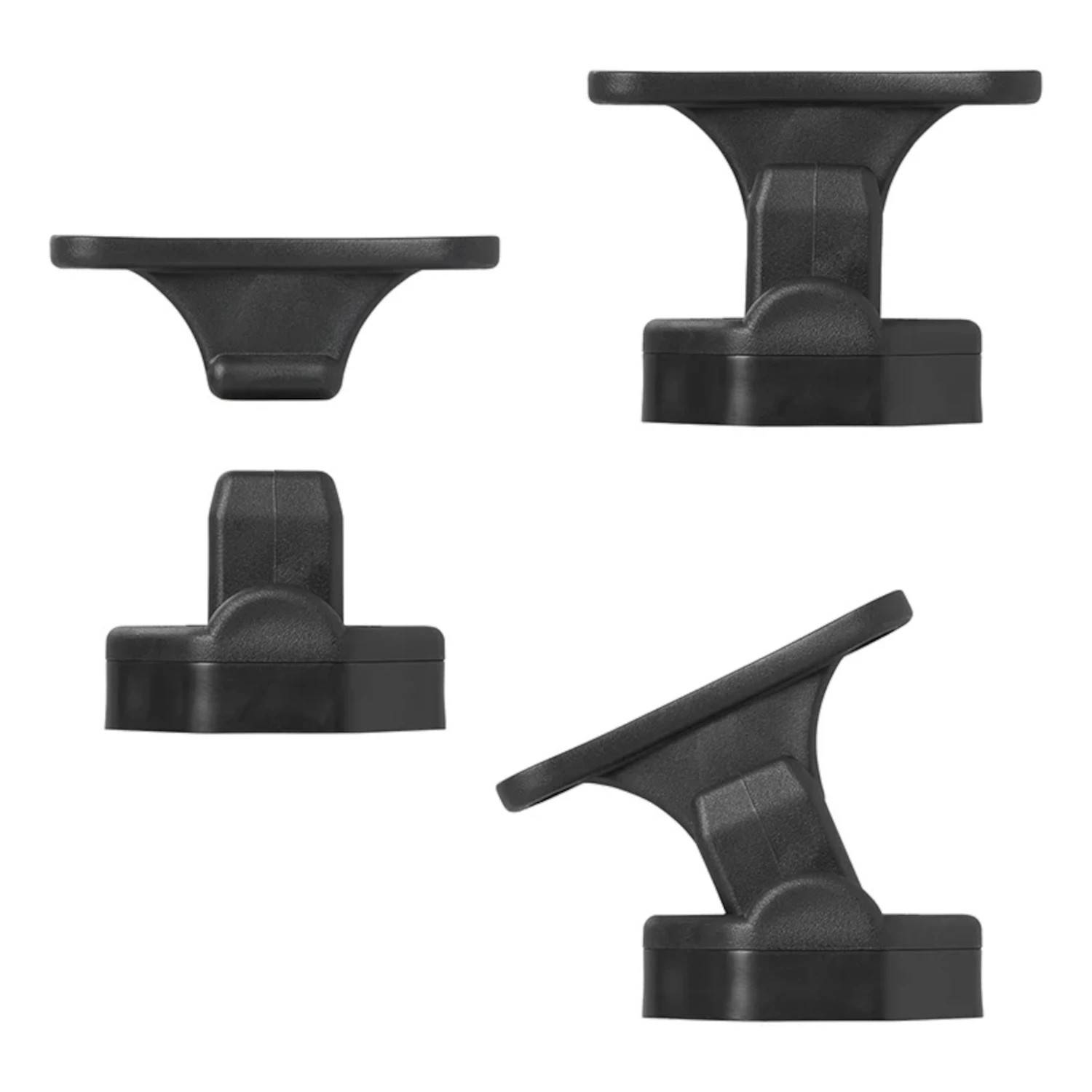 Vier schwarze Kunststoff-Montageklammern unterschiedlicher Formen und Größen, in einem Rastermuster auf einem weißen Hintergrund angeordnet.