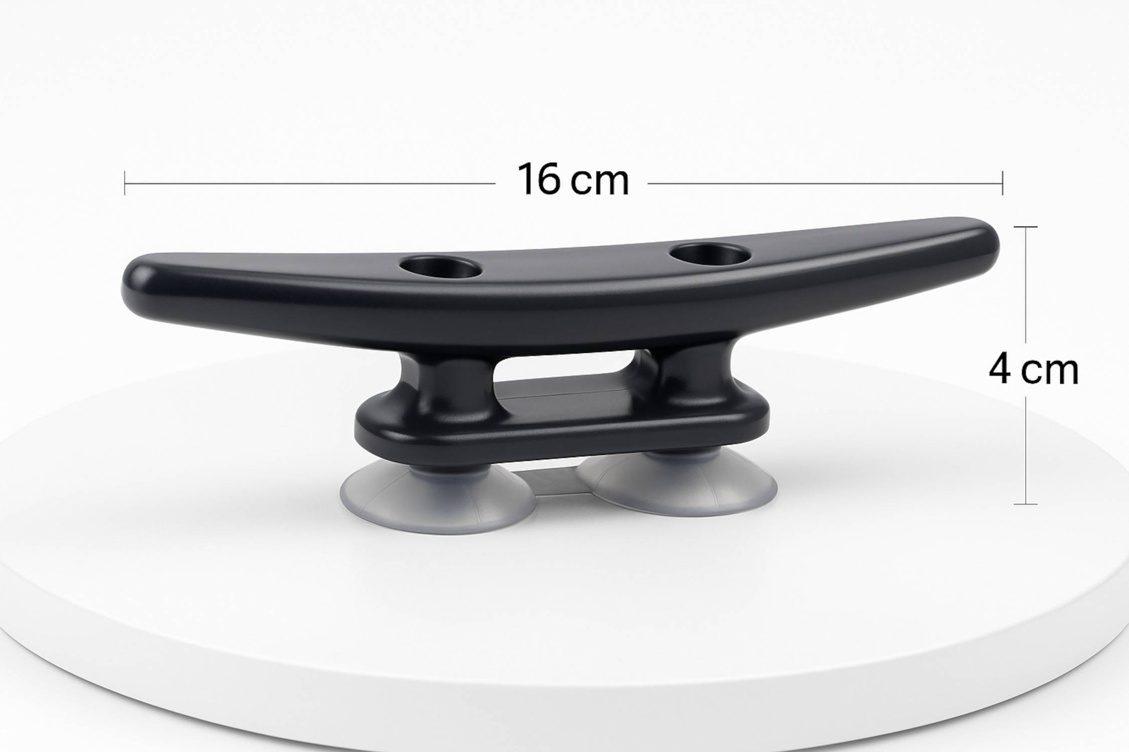 Schwarzer Klemmsockel mit zwei Saugbasen auf einer weißen Oberfläche, 16 cm lang.