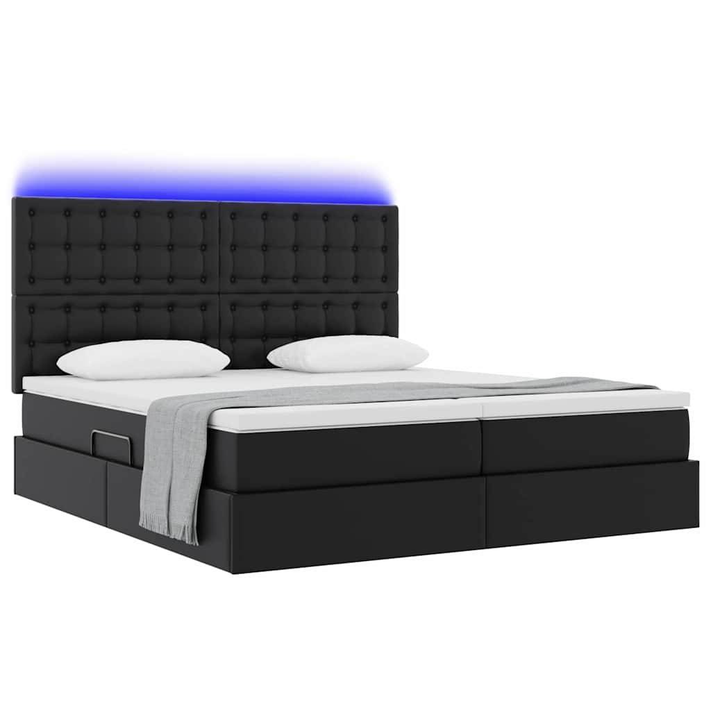 Ein modernes schwarzes Doppelbett mit einem hohen Kopfteil, das quadratische Muster und blaue LED-Beleuchtung aufweist, zwei weiße Kissen und eine graue Decke.