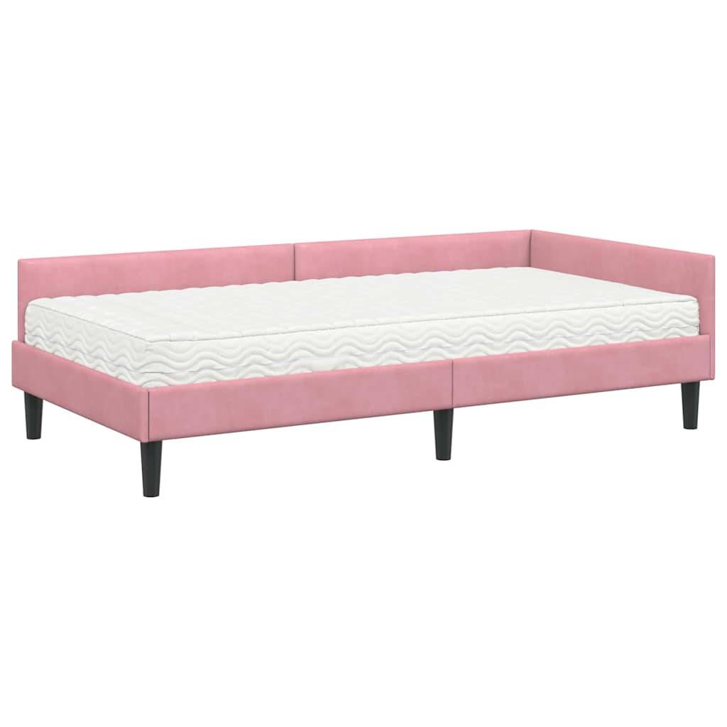 Rosa gepolstertes Tagesbett mit weißer Matratze, mit Wellenmuster verziert und schwarzen Beinen.
