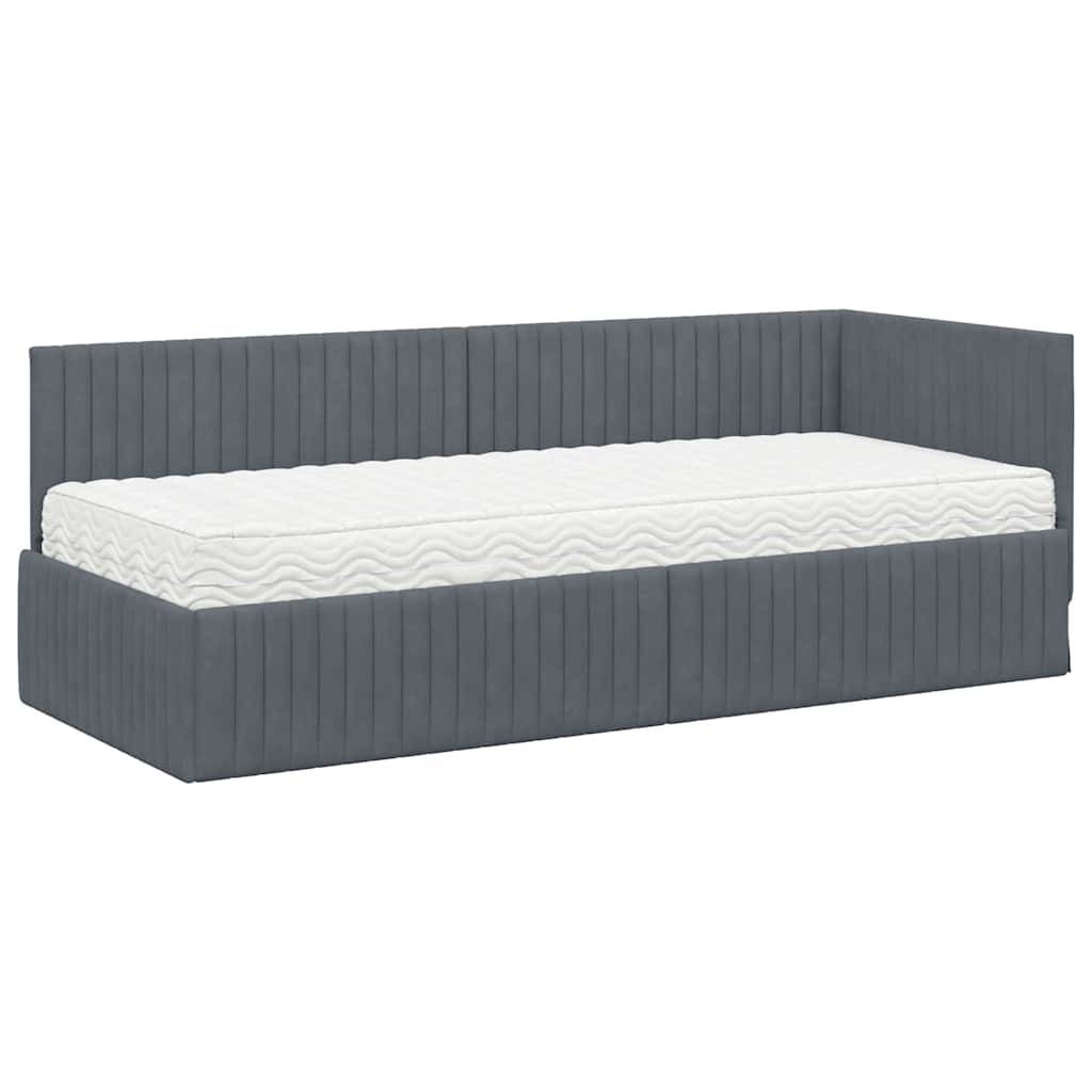 Ein blau gepolstertes Tagesbett mit einer weißen Matratze, das ein geripptes Design auf der Rückenlehne und den Seiten aufweist und sich für ein modernes Schlafzimmer eignet.