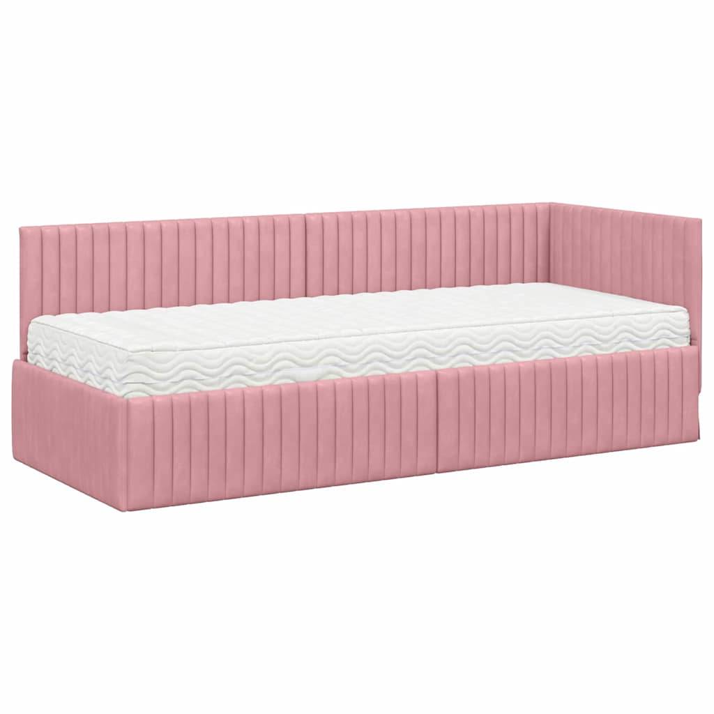 Eine rosa bezogene Tagliege mit einer weißen Matratze, die ein modernes Design und eine gerippte Textur am Rahmen aufweist.