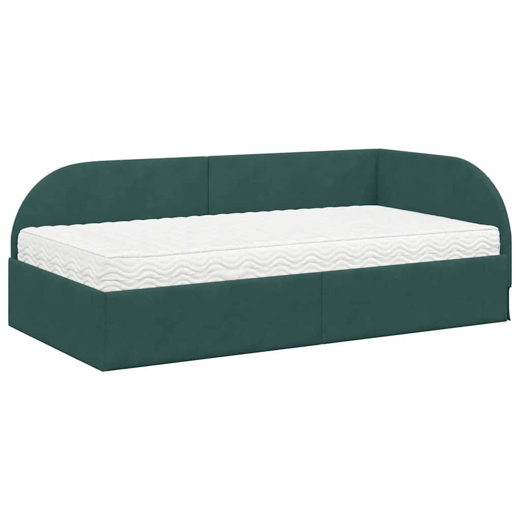 Eine grün gepolsterte Tagesbett mit einer weißen Matratze, ausgestattet mit einer geschwungenen Rückenlehne. Geeignet zum Entspannen oder als zusätzliches Bett in einem Raum.