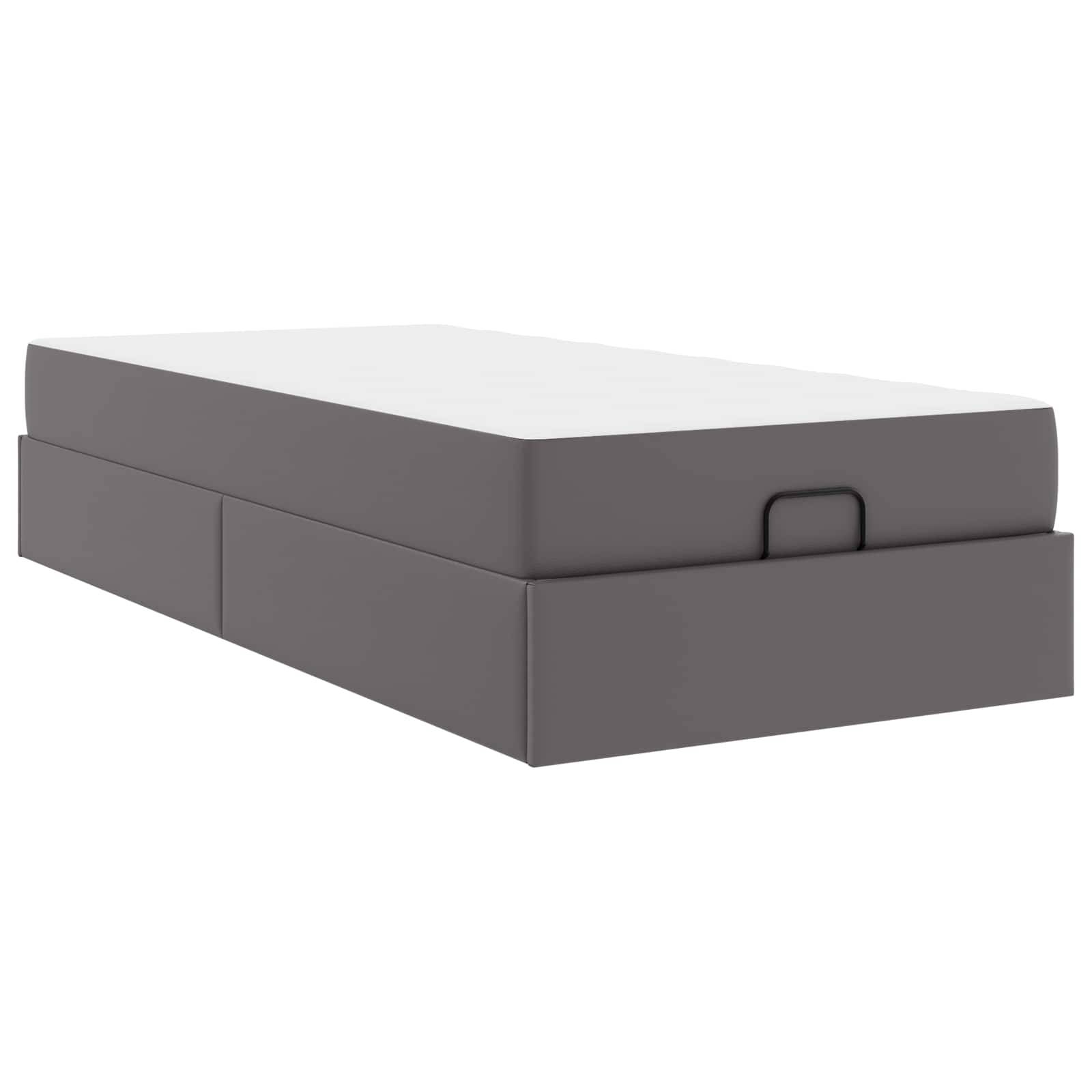 Ein graues Aufbewahrungsbett mit zwei Schubladen unter einer weißen Matratze oben. Das Design ist modern und minimalistisch, geeignet für kompakte Räume.