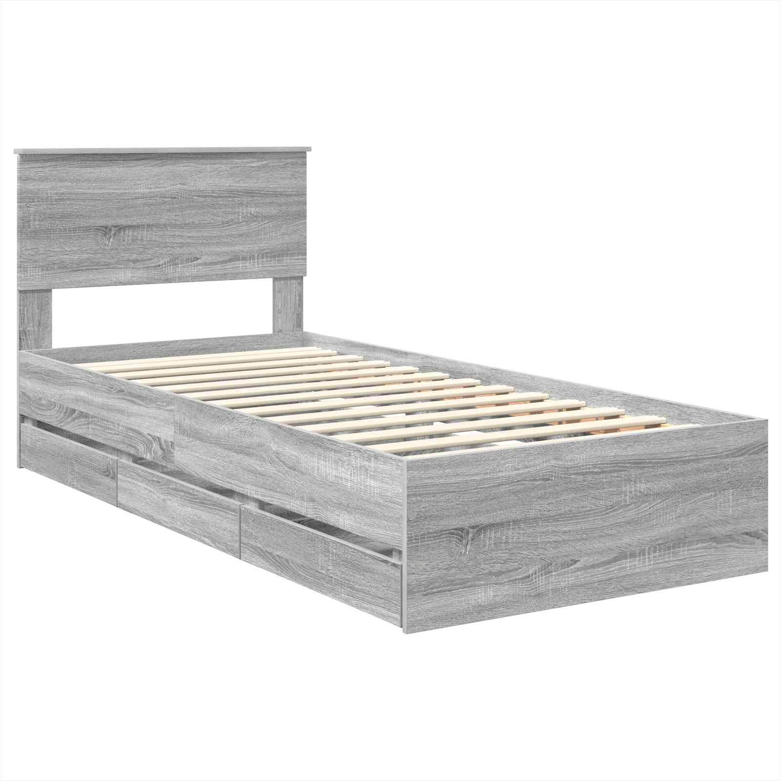 Ein grauer Holz-Zwillingsbettrahmen mit Latten-Unterboden und hohem Kopfteil, ausgestattet mit zwei Aufbewahrungsschubladen an einer Seite.