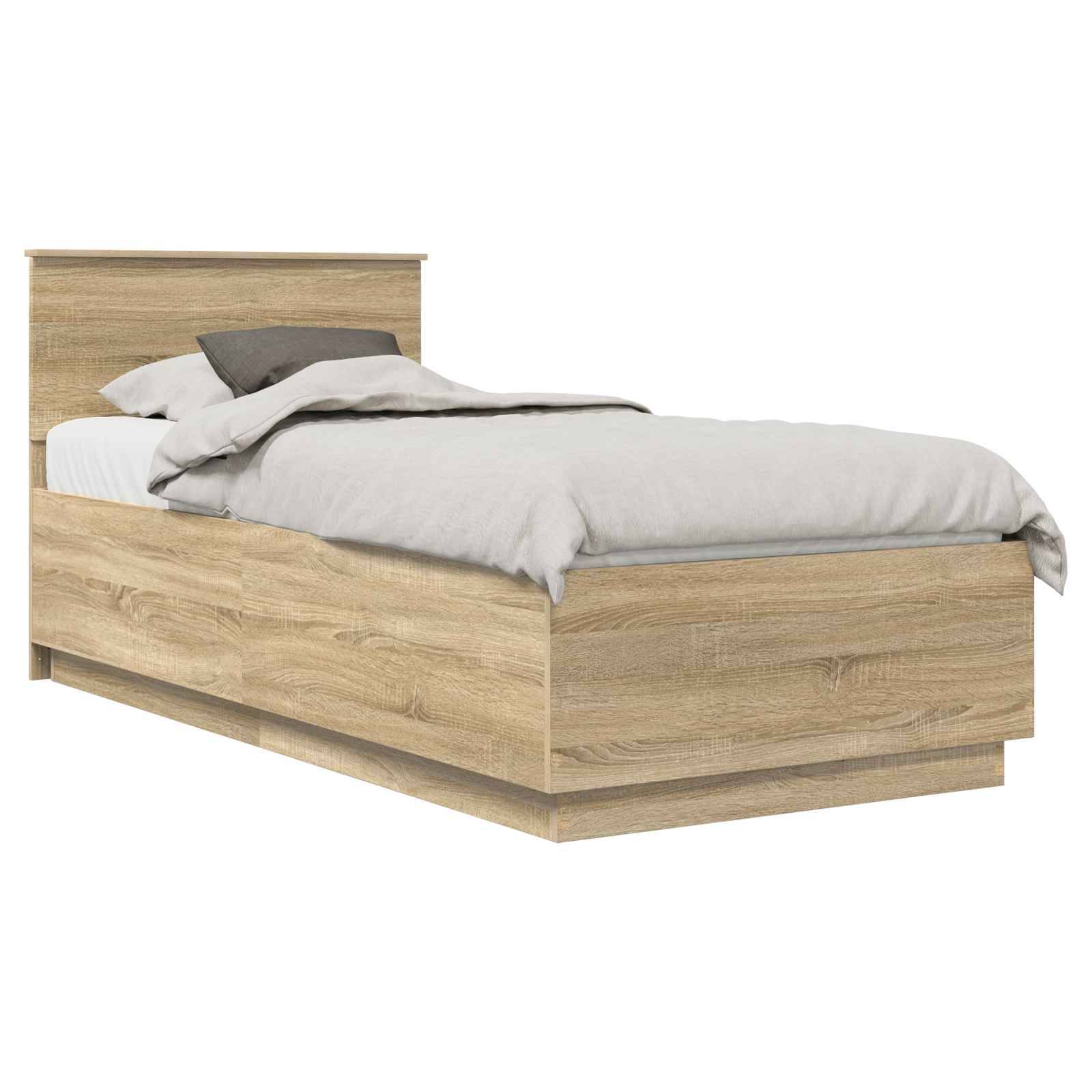 Ein Einzelbett mit einem Holzrahmen, grauem Kopfteil und hellgrauer Bettwäsche, einschließlich zweier Kissen und einer zusammengelegten Decke am Fußende.