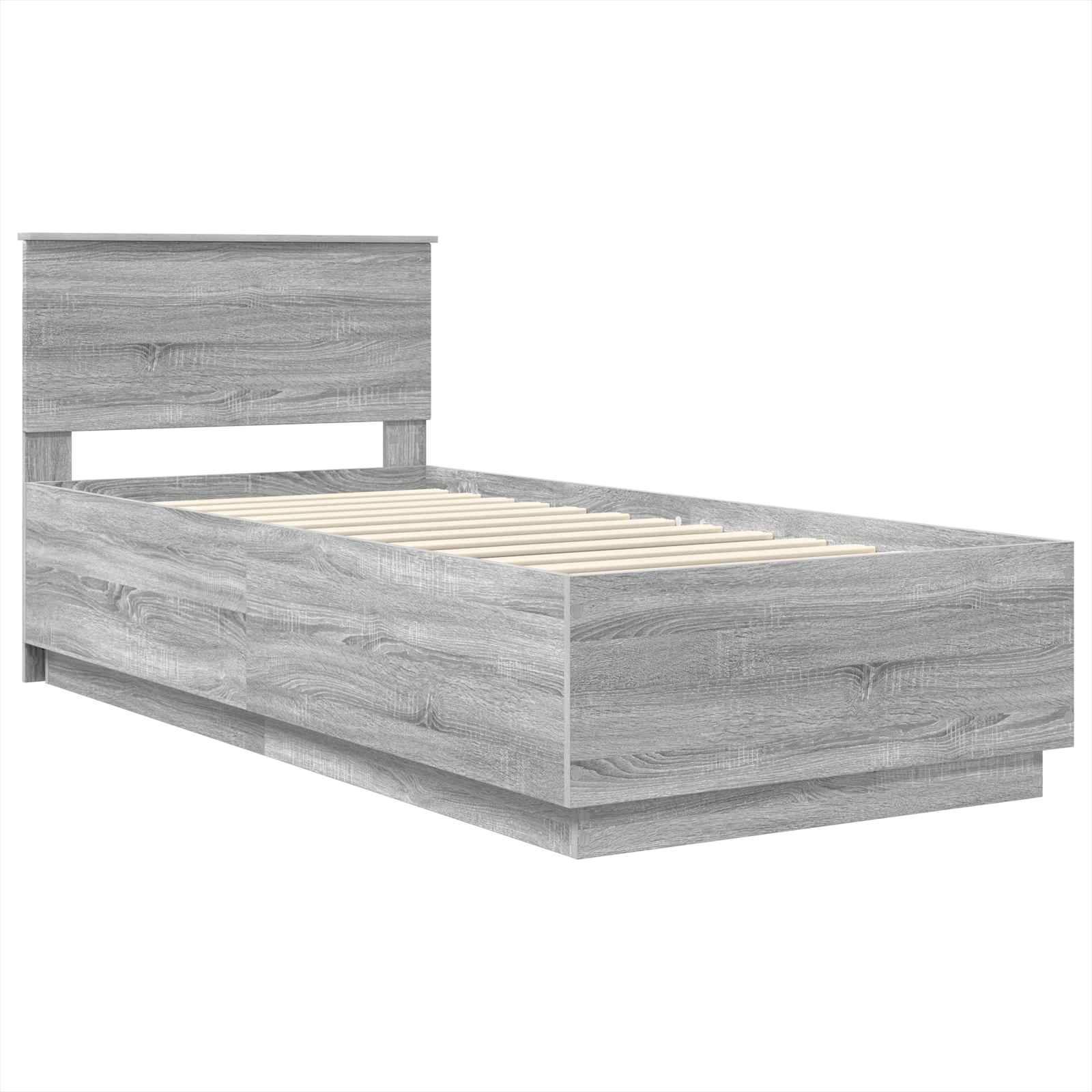 Ein grauer Holz-Einzelbettrahmen mit einem schlichten, modernen Design, ausgestattet mit einem rechteckigen Kopfteil und horizontalen Holzlatten zur Matratzenunterstützung.