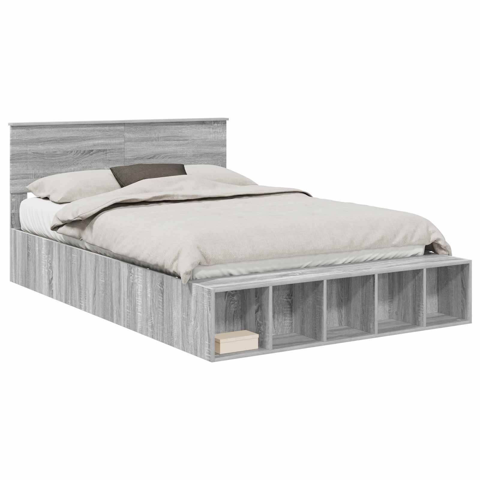 Ein Holz-Doppelbett mit grauer Beschichtung, ausgestattet mit Stauragaregalen am Fußende und ordentlich aufgemachter Bettwäsche.