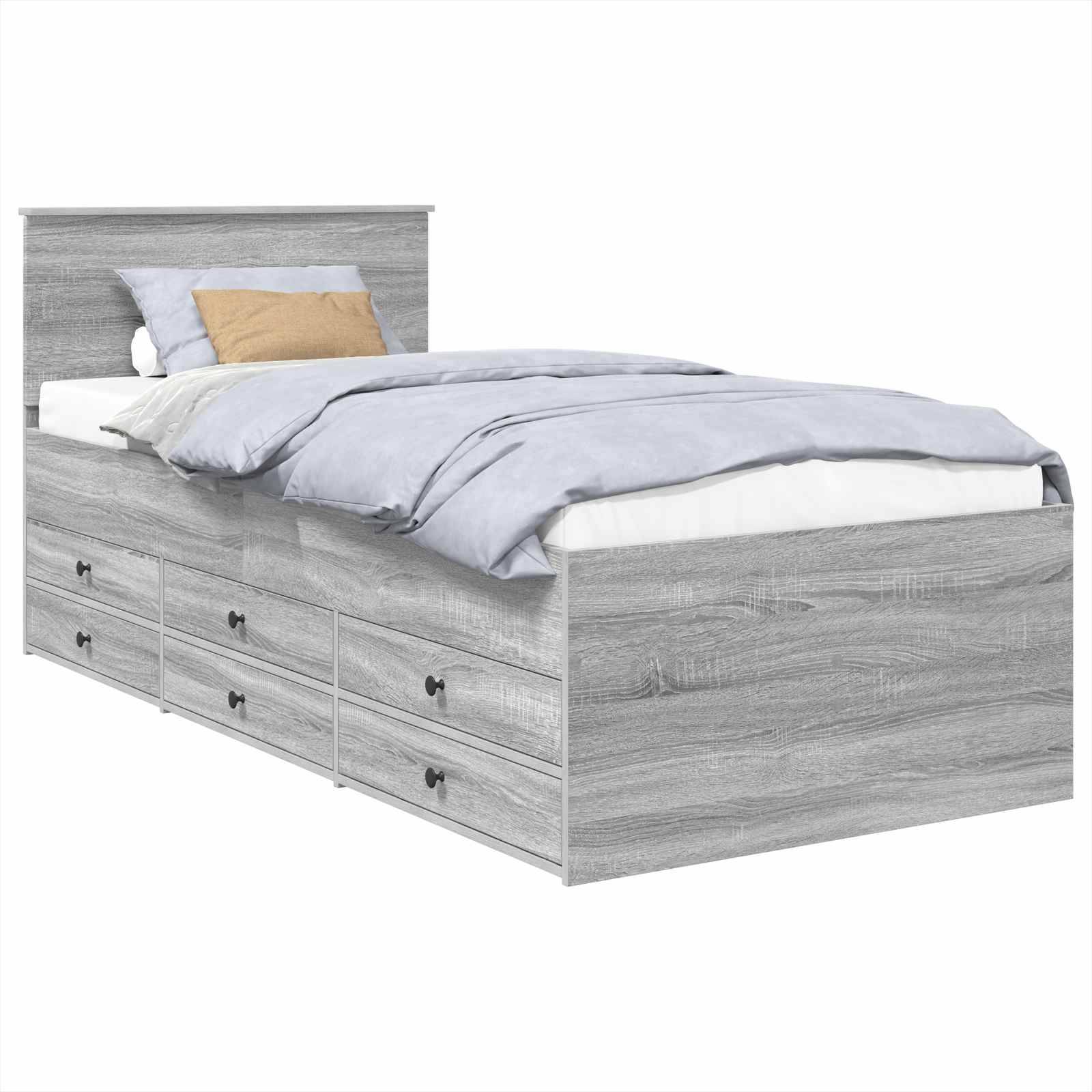 Ein grauer Holzbettrahmen mit sechs Aufbewahrungsschubladen und einem Kopfteil, bedeckt mit einem hellblauen Bettüberwurf, zwei Schlafkissen und einem braunen Zierkissen.