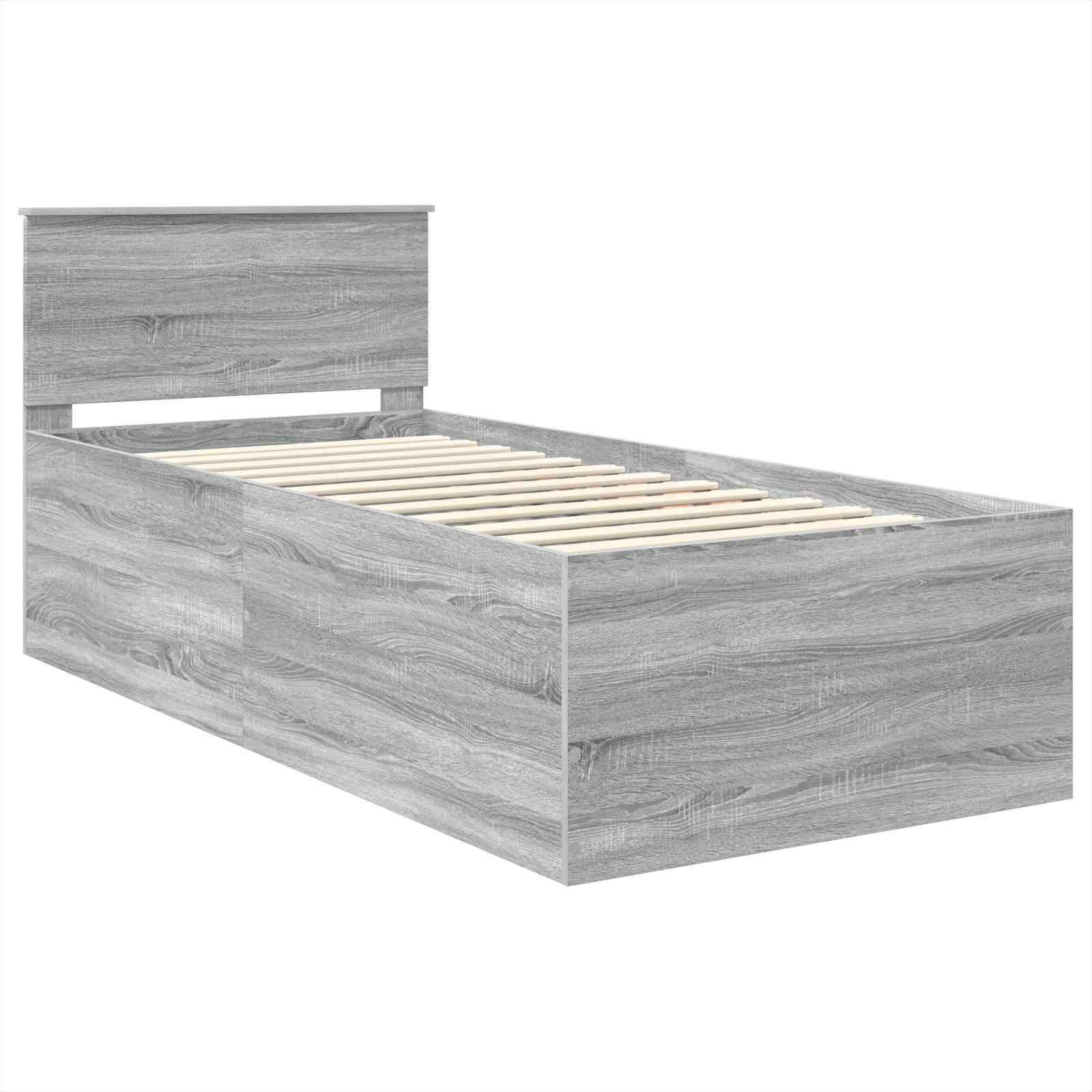 Ein Holz-Einzelbettgestell mit Kopfteil, in hellgrauer Ausführung, ohne Matratze, auf weißem Hintergrund.