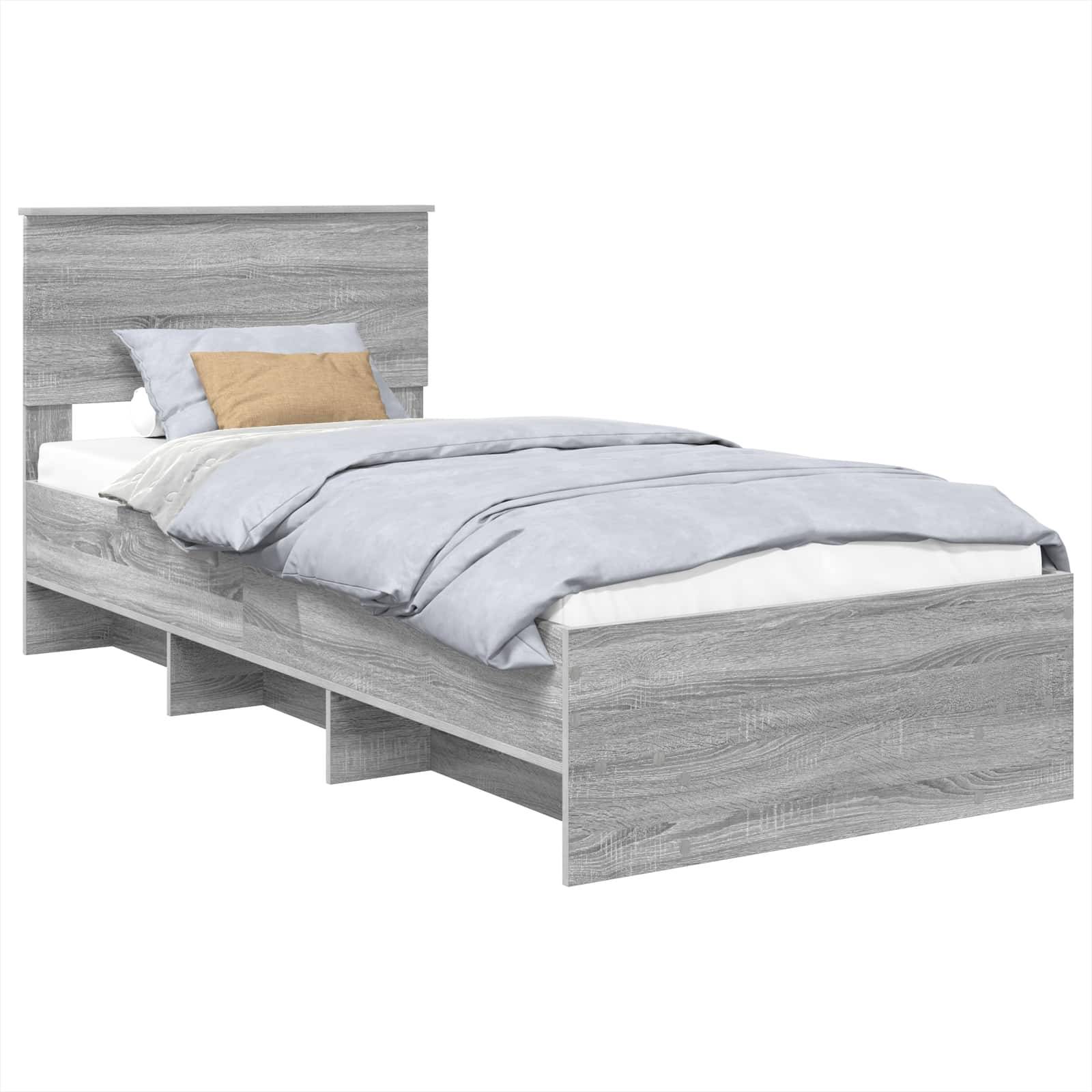 Ein Holz-Einzelbett mit einer hellgrauen Oberfläche, ausgestattet mit einem Kopfteil und integrierten Staurageschubladen darunter, bedeckt mit einem sorgfältig bezogenen hellblauen Bettwäscheset und Kissen.