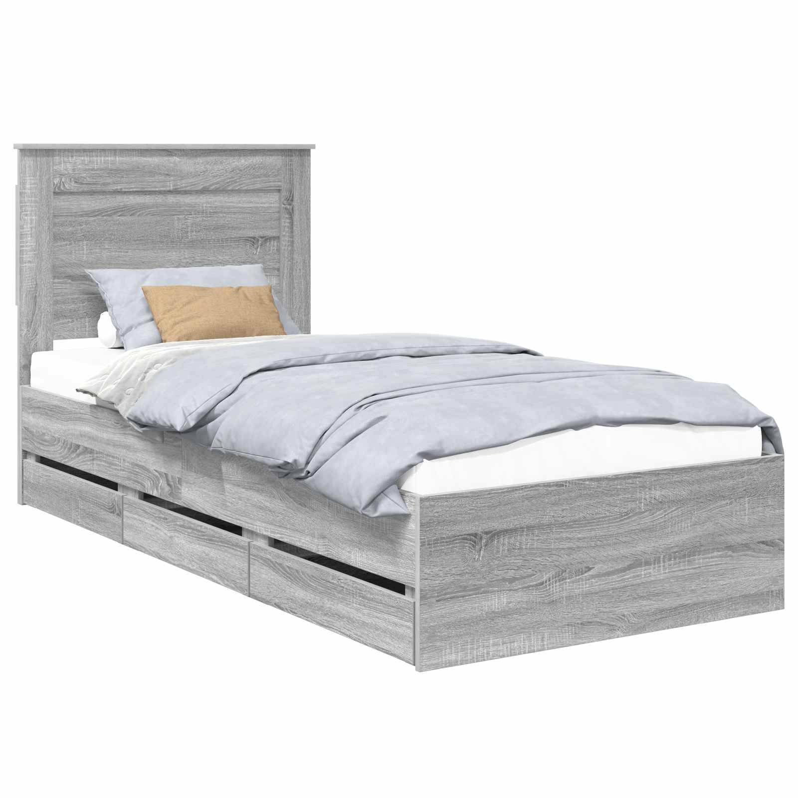 Ein Holz-Einzelbett mit hohem Kopfteil hat einen hellgrauen Anstrich und drei eingebaute Staurageschubladen unter dem Bettgestell.
