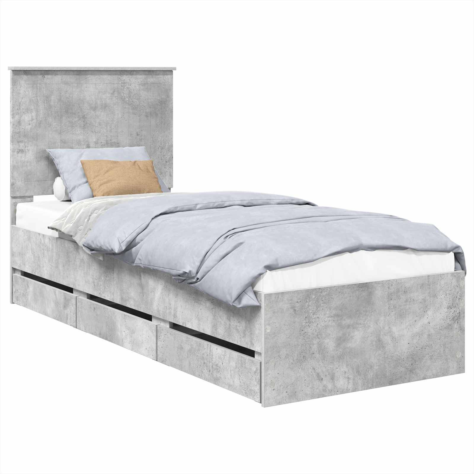 Ein Einzelbett mit Betongrau-Oberfläche, das drei Lagerschubladen darunter aufweist. Das Bett ist mit hellgrauer Bettwäsche ausgestattet und verfügt über ein braunes Akzentkissen.