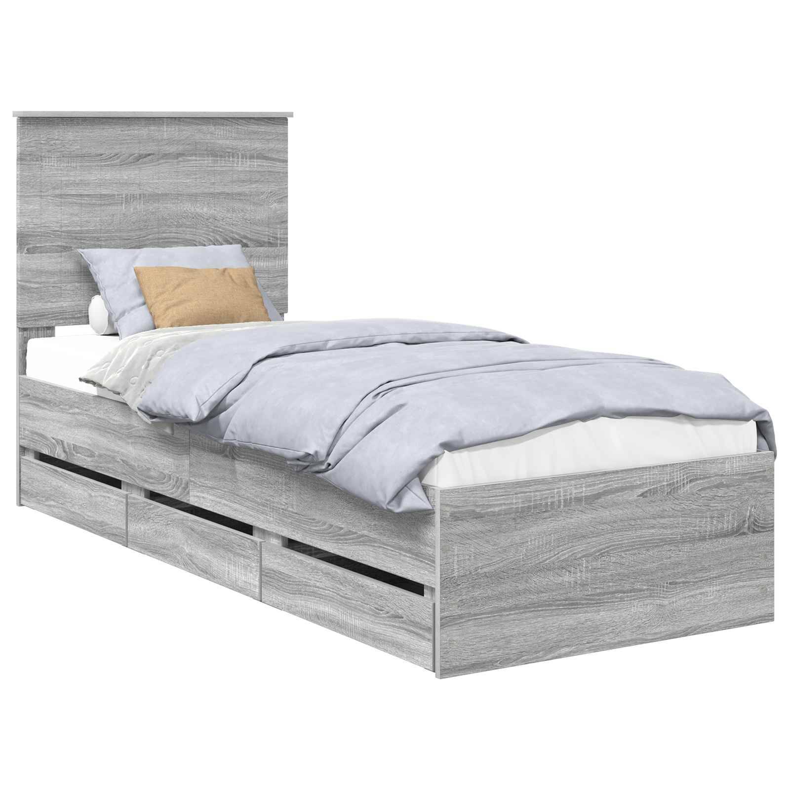 Ein grauer Holz-Doppelbett mit Kopfteil, bezogen mit hellblauer Bettwäsche und einem beigen Dekokissen, mit Staurageschubladen darunter.