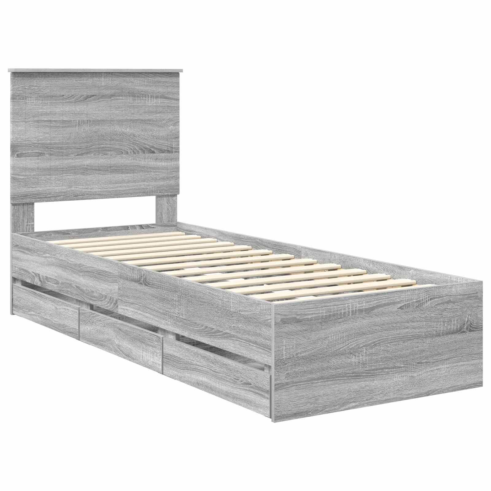 Ein grauer Holz-Doppelbett-Rahmen mit einem schlichten Kopfteil und herausziehbaren Aufbewahrungsschubladen darunter.