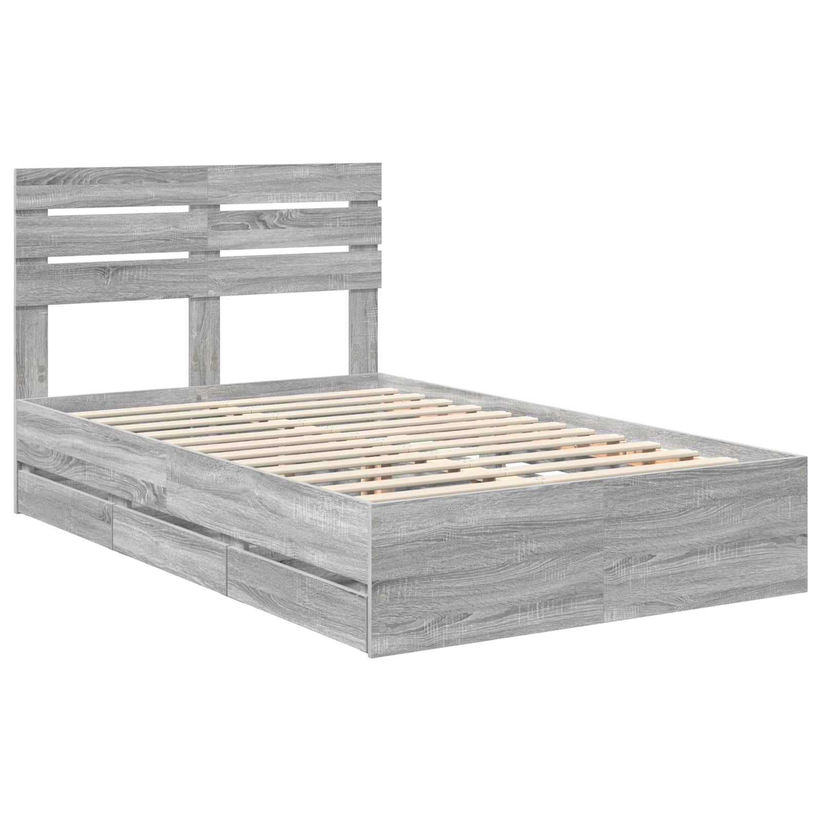 Ein grauer Holzlattenrahmen mit Kopfteil, von einem schrägen Winkel aus gezeigt. Keine Matratze ist auf dem Bett, wodurch die Holzlatten hervorgehoben werden.