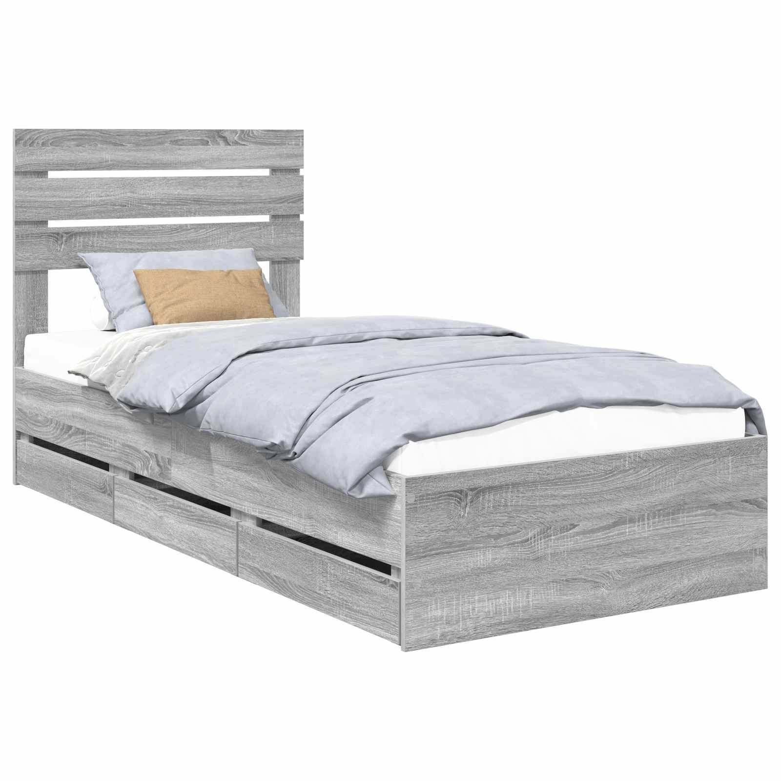Ein Holzbettgestell mit einem Lamellenrahmen am Kopfende, versehen mit einem hellen Grauton. Das Bett ist bezogen mit blauer Bettwäsche und zwei Kissen.