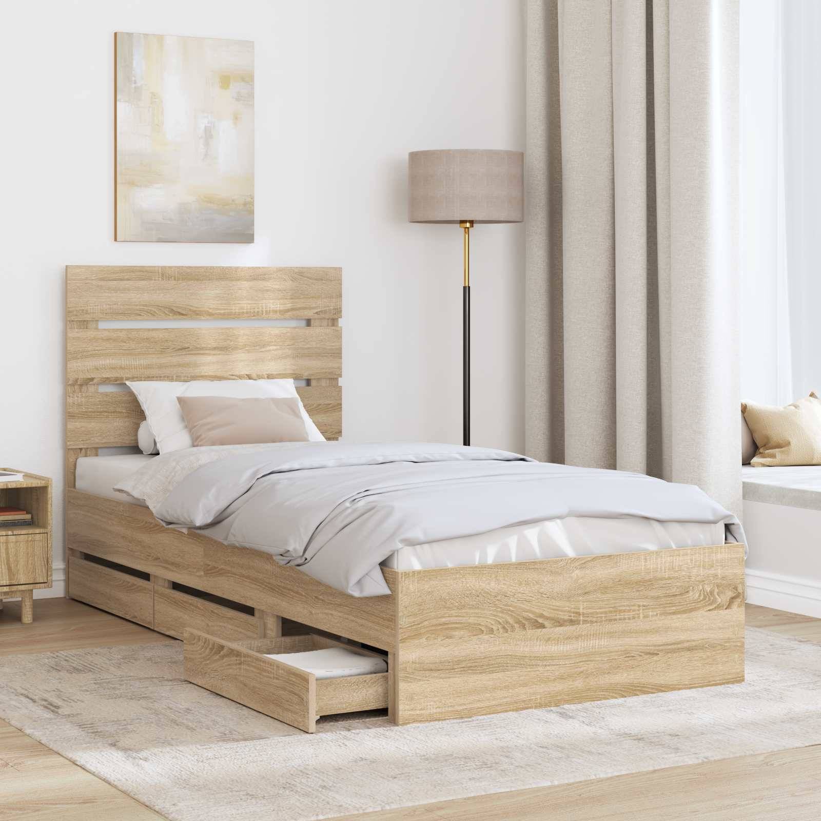 Ein modernes Schlafzimmer zeigt ein Holzbett mit einer Schublade zur Aufbewahrung, einen Nachttisch und eine Lampe. Neutrale Farbtöne schaffen eine gemütliche und minimalistische Atmosphäre.