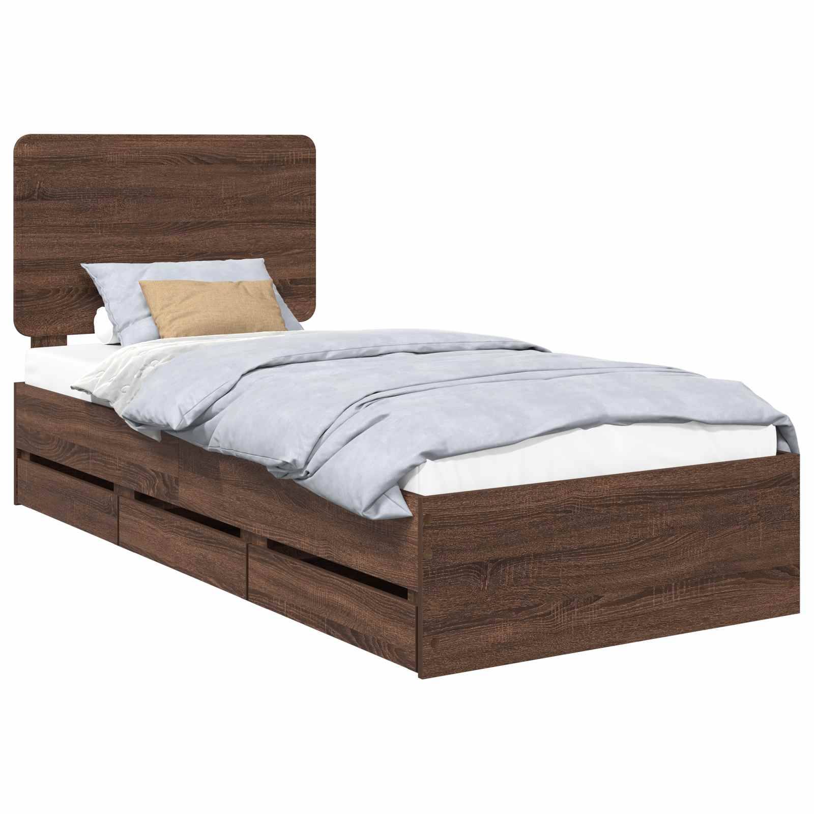 Ein Holz-Einzelbett mit Kopfteil, blauer Bettdecke, weißen Laken und einem beigen Kissen. Die Bettbasis verfügt über Staurageschubladen.