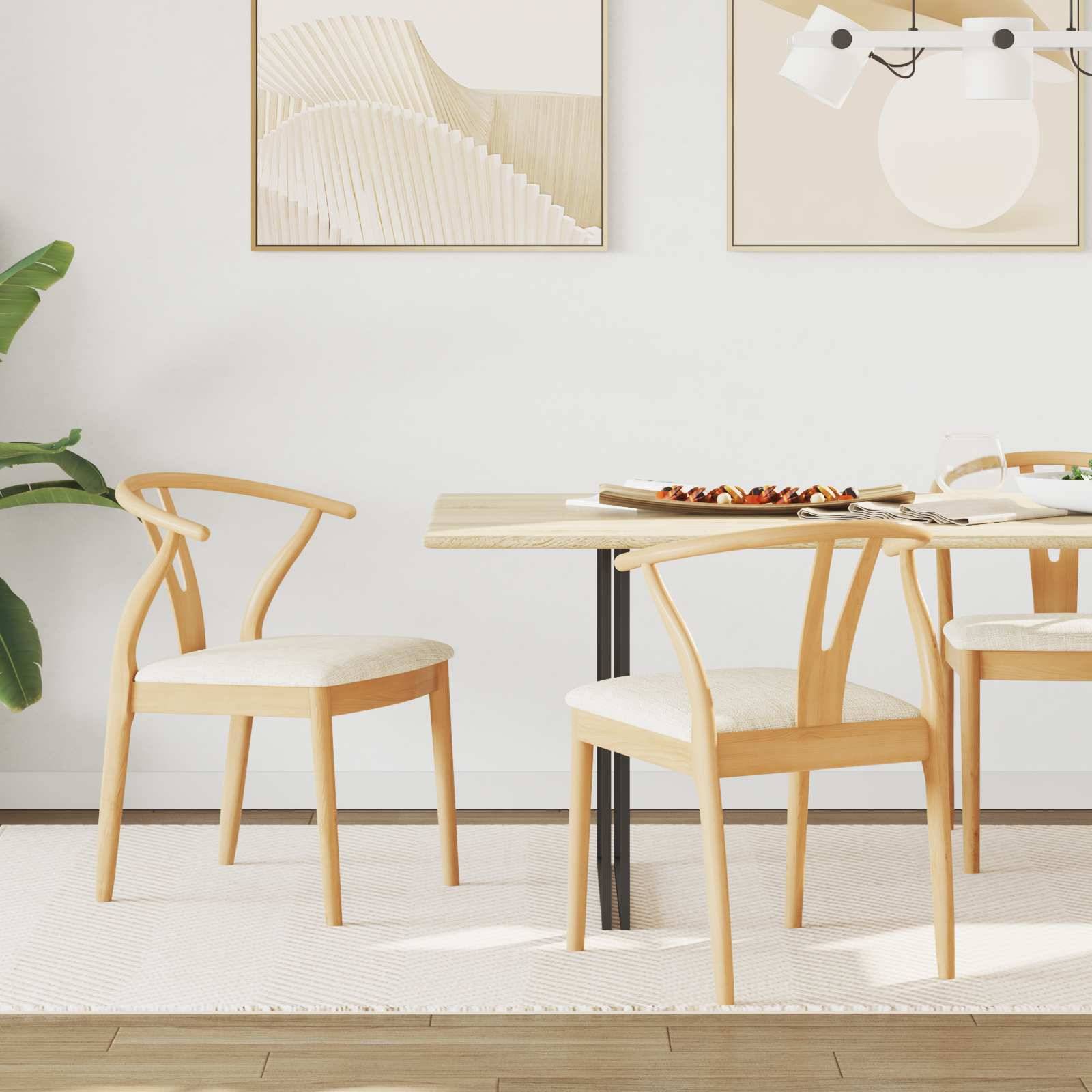 Ein moderner Essbereich mit einem Holztisch, vier Stühlen aus hellem Holz, einer Pflanze und minimalistischer Kunst an der Wand, der eine gemütliche Atmosphäre schafft.