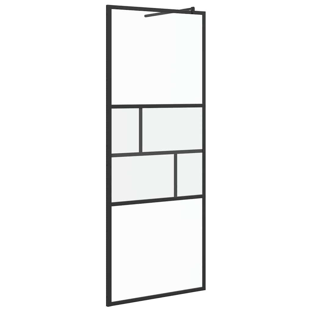 Eine schwarzgerahmte, rechteckige Glastür mit mehreren klaren Glaselementen, die in einem geometrischen Muster angeordnet sind.