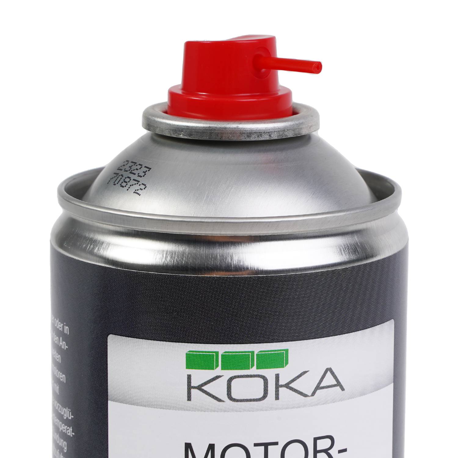 Eine Sprühdose von 'Koka' Motoröl mit einer roten Düse und einem schwarzen Etikett.