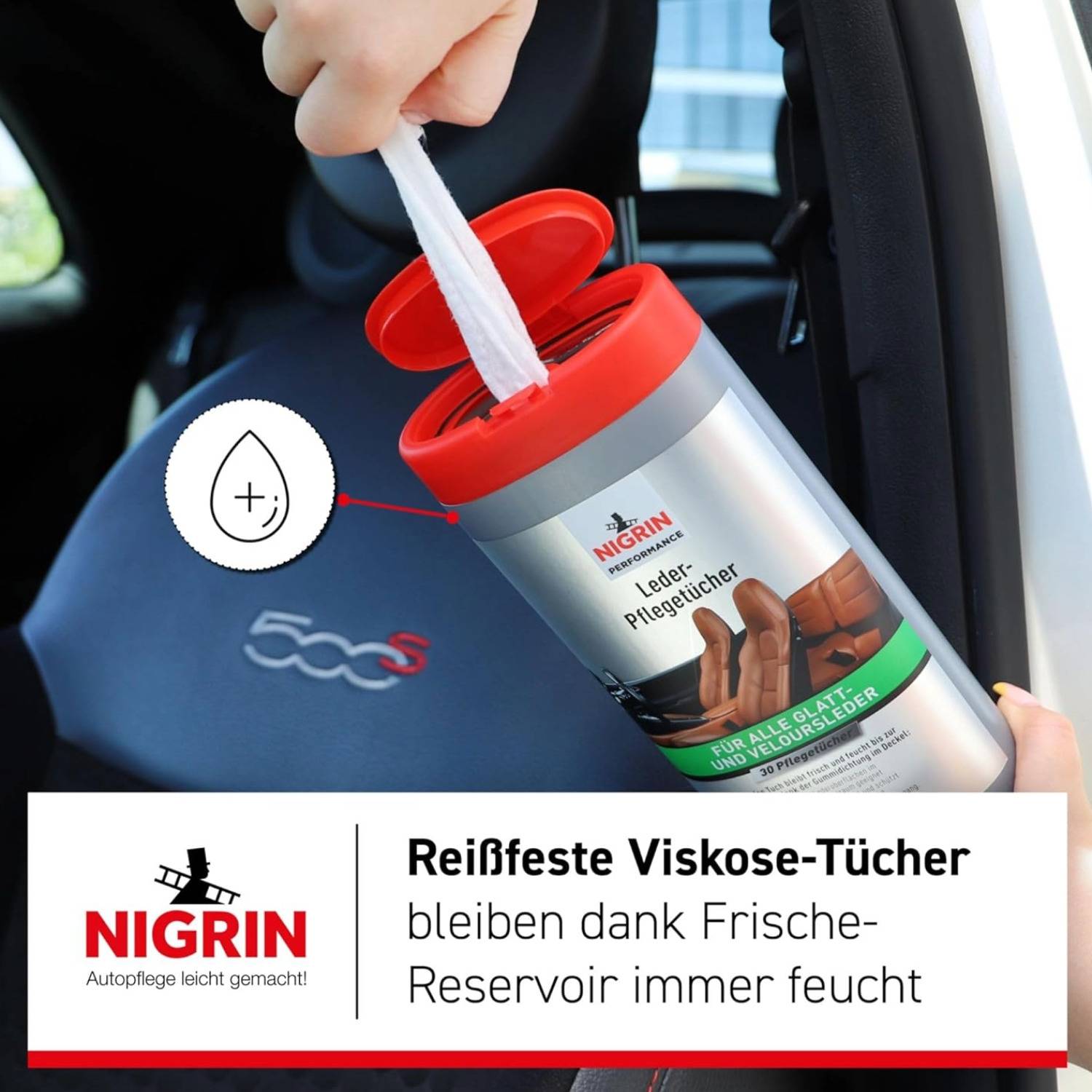 Eine Person zieht ein feuchtes Tuch aus einem zylindrischen Behälter, der mit 