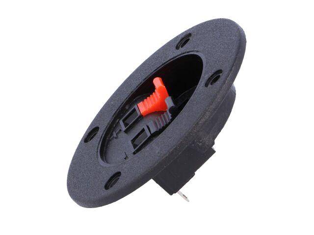 Ein runder schwarzer Lautsprecherterminal mit einem roten Hebel für Drahtanschlüsse.