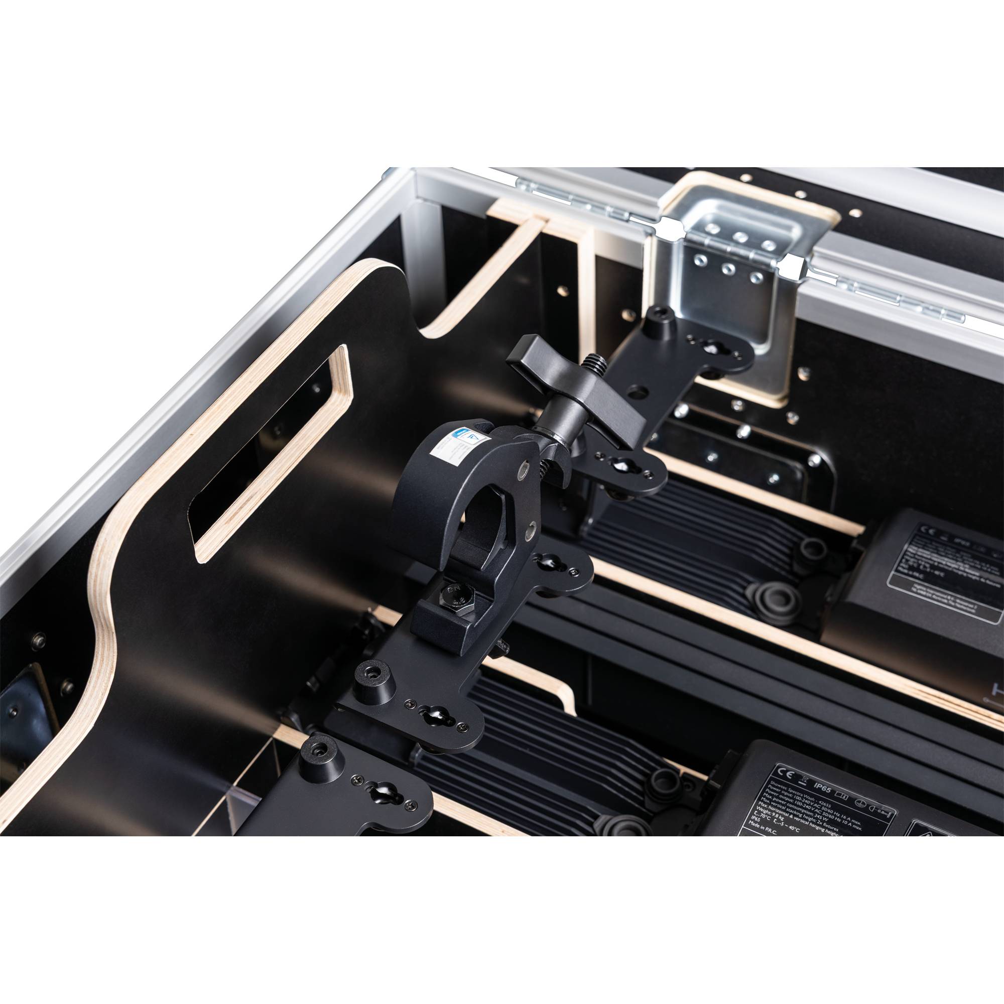 Nahaufnahme einer präzisen mechanischen Baugruppe mit montierten Komponenten, bestehend aus Metall- und Kunststoffteilen, Schrauben und elektrischen Anschlüssen.