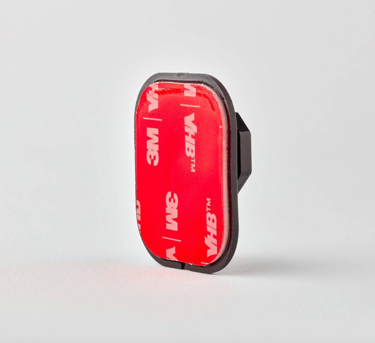 Ein rotes, selbstklebendes rechteckiges Objekt mit dem Logo „3M VHB