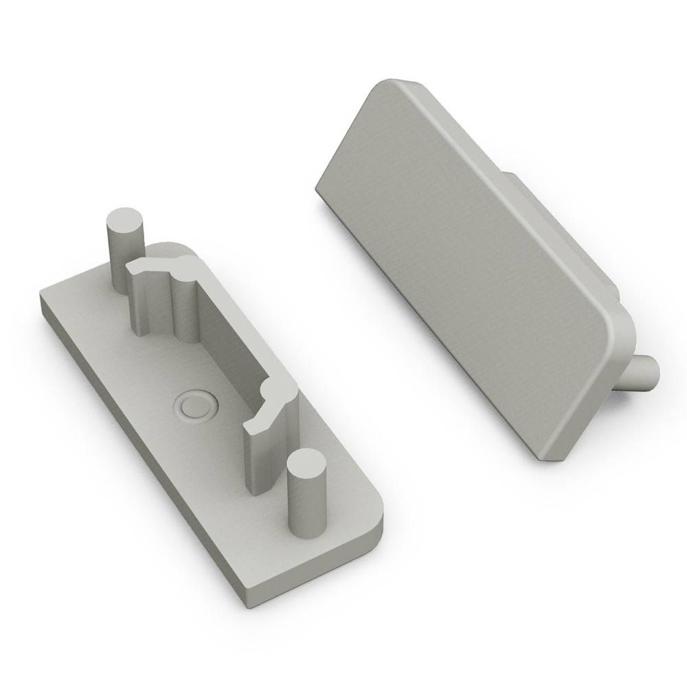 Zwei graue Kunststoffkomponenten, eine schräg angebracht und eine flach liegend, zeigen einen Verbindungsmechanismus mit zylindrischen Stiften und Schlitzen.
