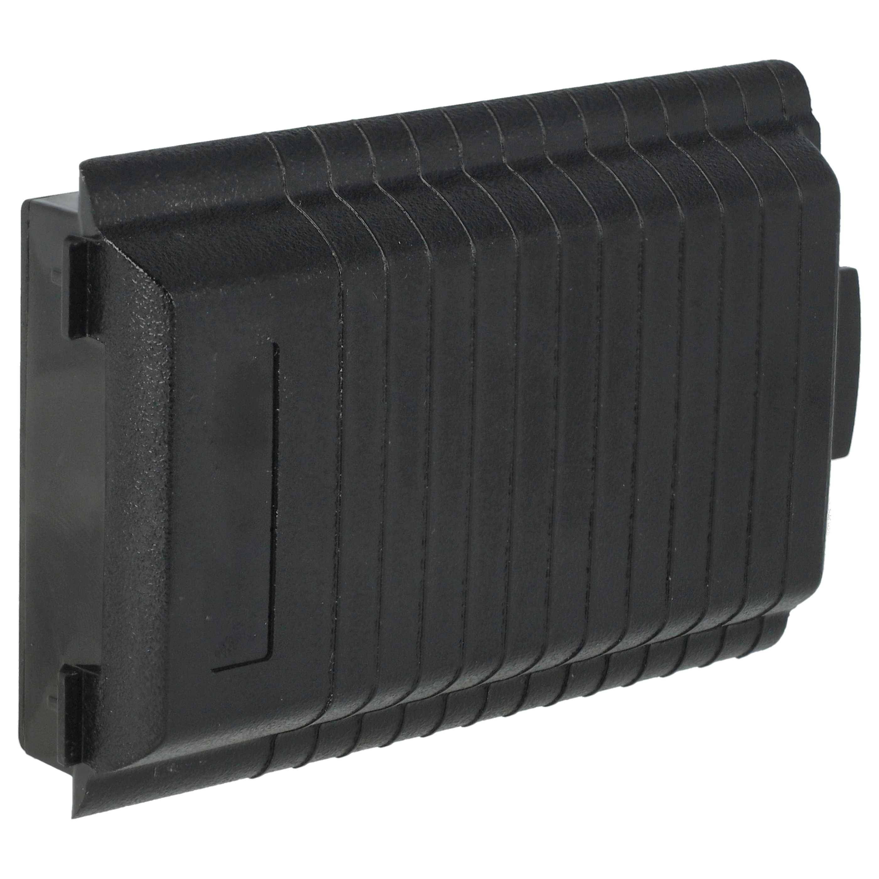 Eine schwarze Plastikabdeckung mit gerippter Textur, höchstwahrscheinlich eine Schutzverkleidung für elektronische Komponenten oder Anschlüsse.